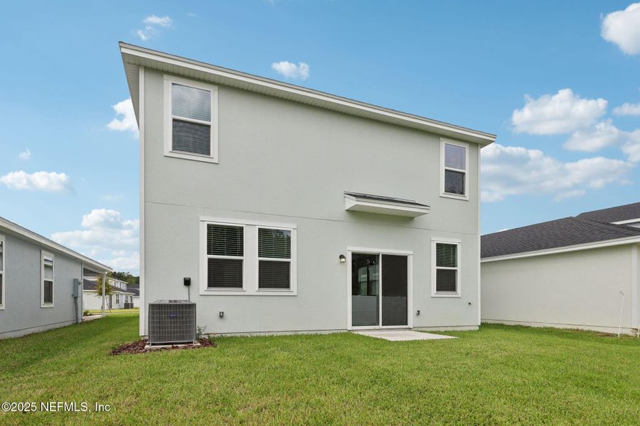 Front exterior of a new home in Kings Crossing, Jacksonville, FL, highlighting curb appeal (Image 25). Front exterior of a new home in Kings Crossing, Jacksonville, FL, highlighting curb appeal (Image 25).