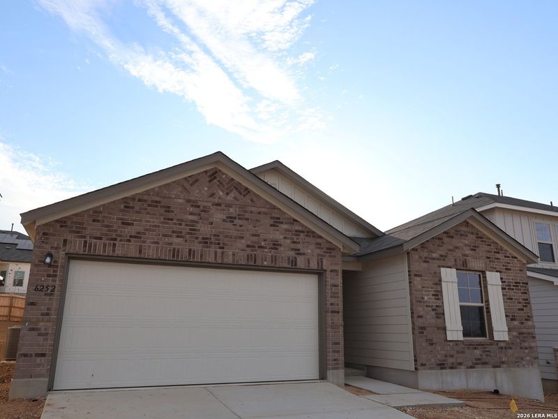 Front exterior of a new home in Mesquite Ridge, San Antonio, TX, highlighting curb appeal (Image 18).