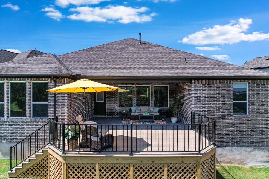 The spacious covered patio and extended deck offers extra storage underneath the deck.