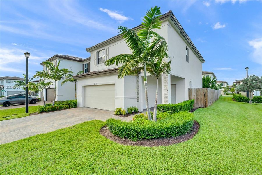 Front exterior of a new home in , Homestead, FL, highlighting curb appeal (Image 27). Front exterior of a new home in , Homestead, FL, highlighting curb appeal (Image 27).