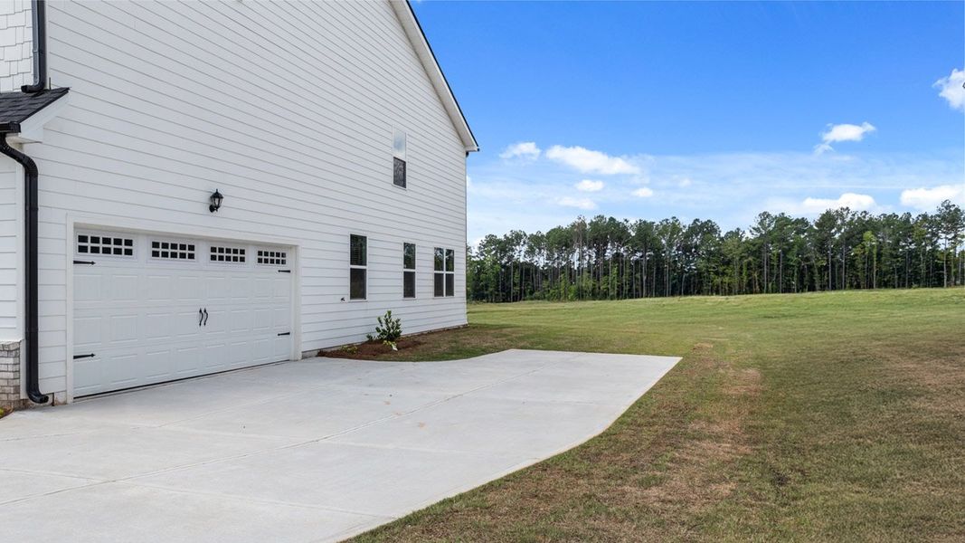 Exterior details and patio area of a home in Oakchase at Hampton, Hampton (Image 3). Exterior details and patio area of a home in Oakchase at Hampton, Hampton (Image 3).