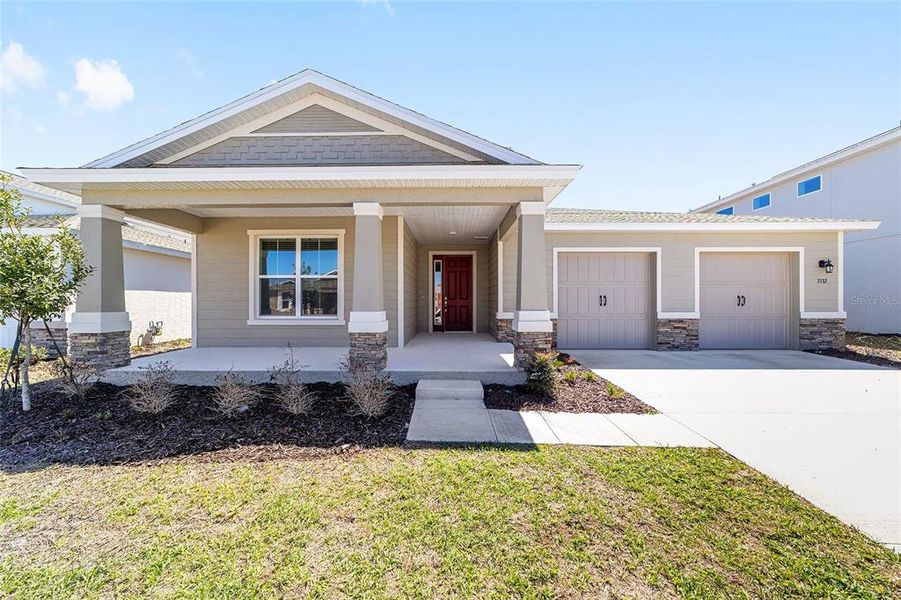 Front exterior of a new home in Calesa Township, Ocala, FL, highlighting curb appeal (Image 21).