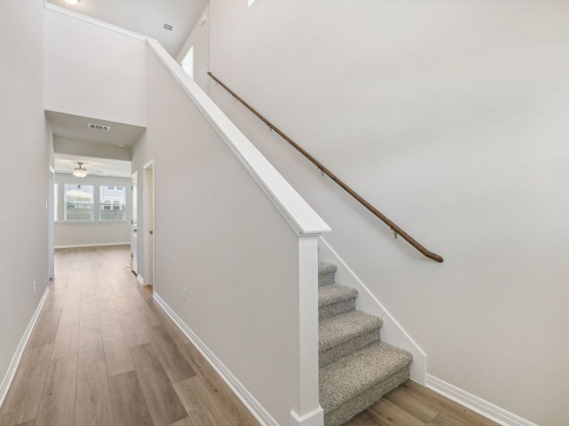 The loft and all the bedrooms are on the second floor of this home.