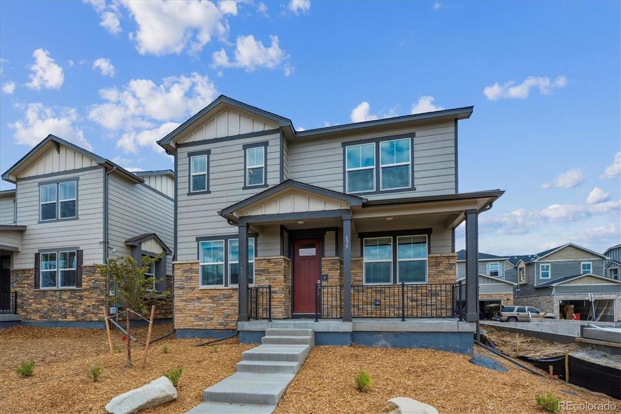 Front exterior of a new home in Horizon Uptown, Aurora, CO, highlighting curb appeal (Image 2).
