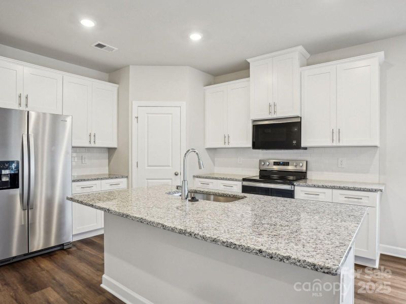 Photos are not of the actual home, but are photos of the builder home with same floorplan with similar interior finishes.