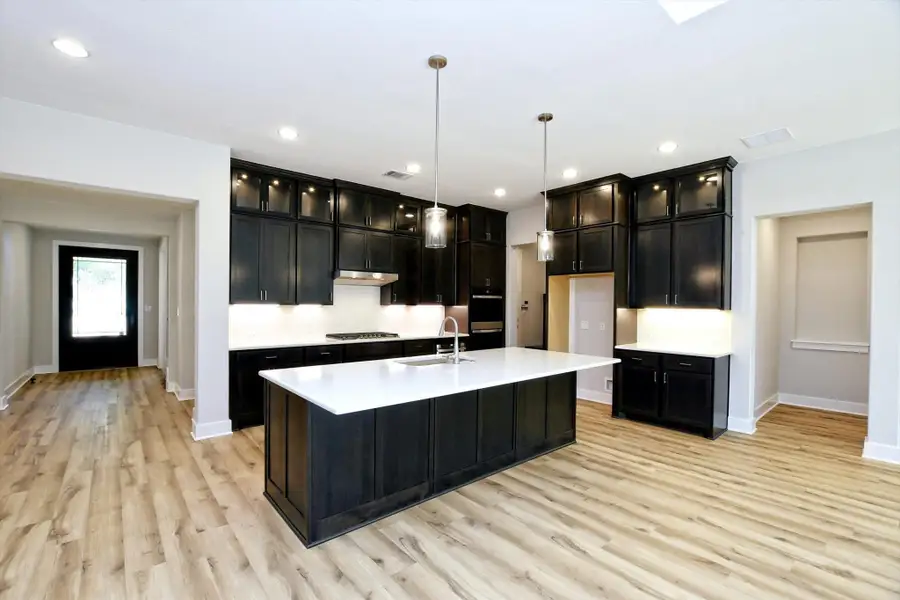 Representative furnished interior of a home built from the Vanderpool II by Giddens Homes in Whispering Wind, Bertram (Image 7).