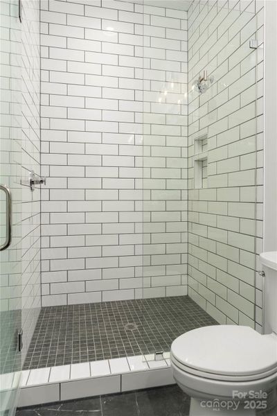 Lower level walk-in shower conveniently located directly off garage - interior of lot 1 home Lower level walk-in shower conveniently located directly off garage - interior of lot 1 home