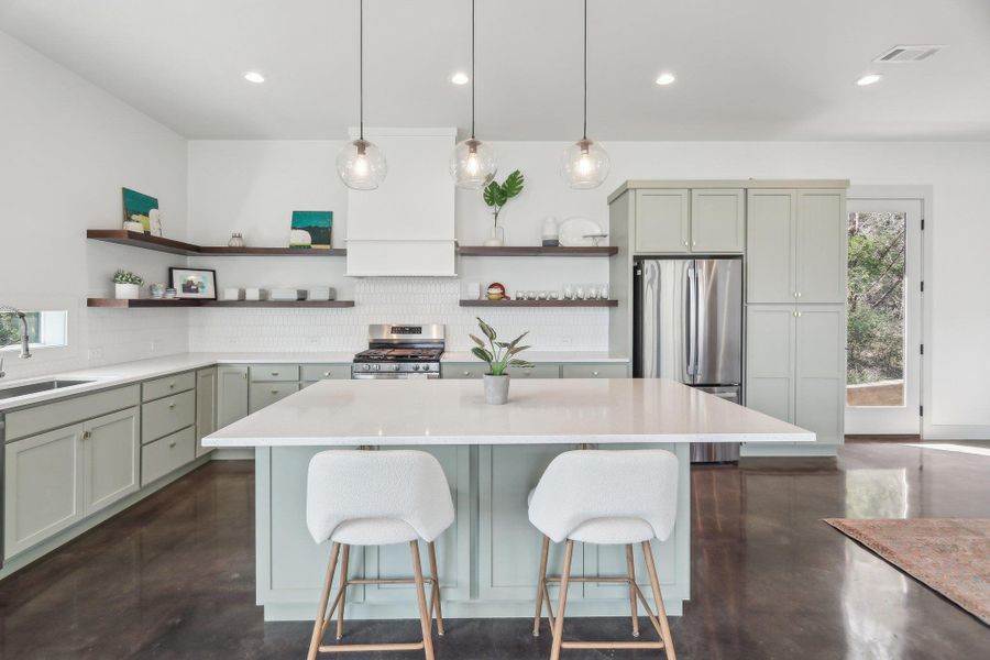 Kitchen featuring open shelves, appliances with stainless steel finishes, concrete floors, backsplash, and recessed lighting Kitchen featuring open shelves, appliances with stainless steel finishes, concrete floors, backsplash, and recessed lighting