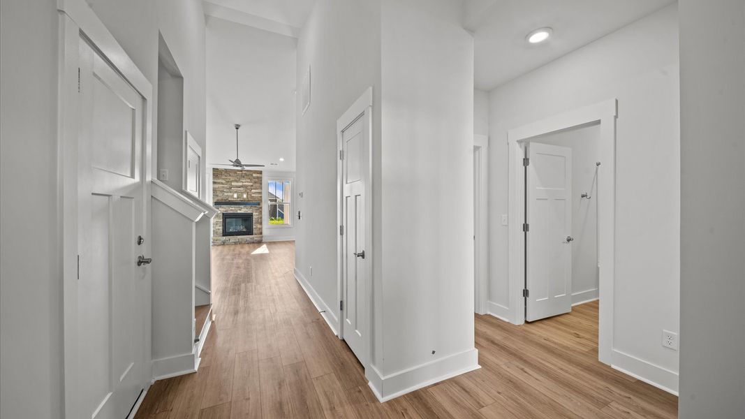 Notable hardwood flooring enhances the elegance of this accomplished entryway