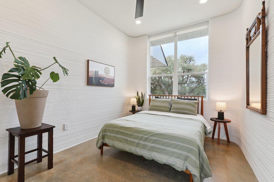 Bedroom with concrete floors, recessed lighting, and a ceiling fan