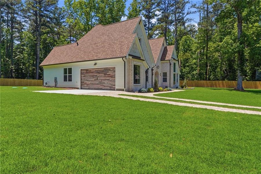 Front exterior of a new home in , Powder Springs, GA, highlighting curb appeal (Image 32).