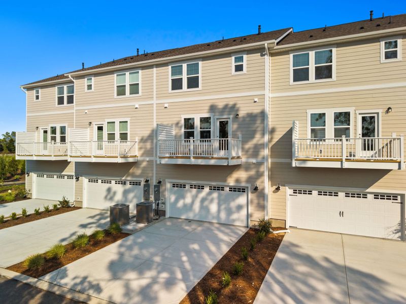 Front exterior of a new home in Lakeside Townes at Riverlights, Wilmington, NC, highlighting curb appeal (Image 22). Front exterior of a new home in Lakeside Townes at Riverlights, Wilmington, NC, highlighting curb appeal (Image 22).