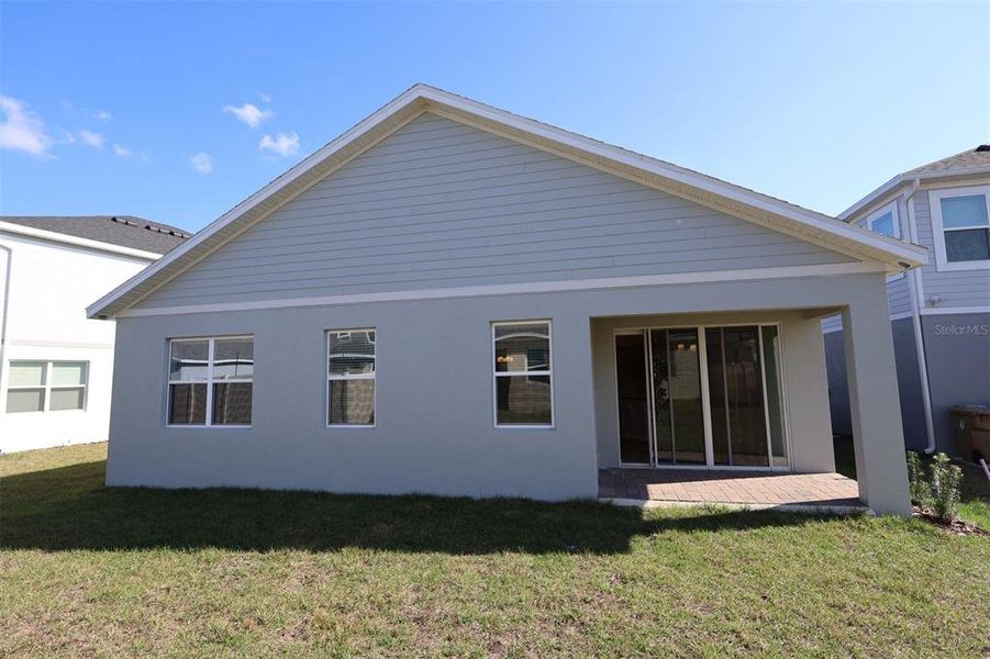 Exterior details and patio area of a home in Bay Lake Farms, St. Cloud (Image 4).