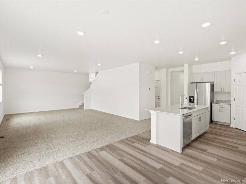 Spacious, unfurnished interior of a new home in Ridgeline Vista: The Flora Collection, Brighton (Image 20).