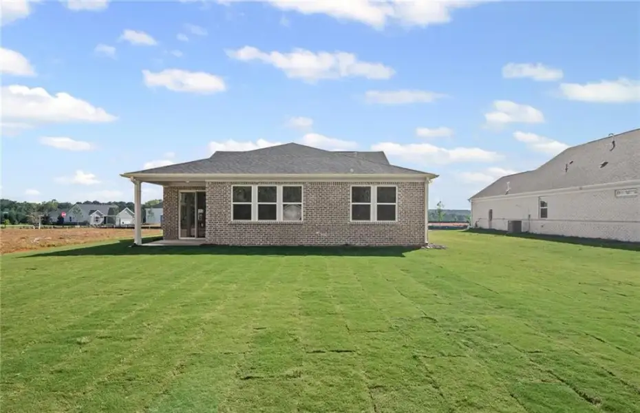 Exterior details and patio area of a home in Overland, Locust Grove (Image 21).