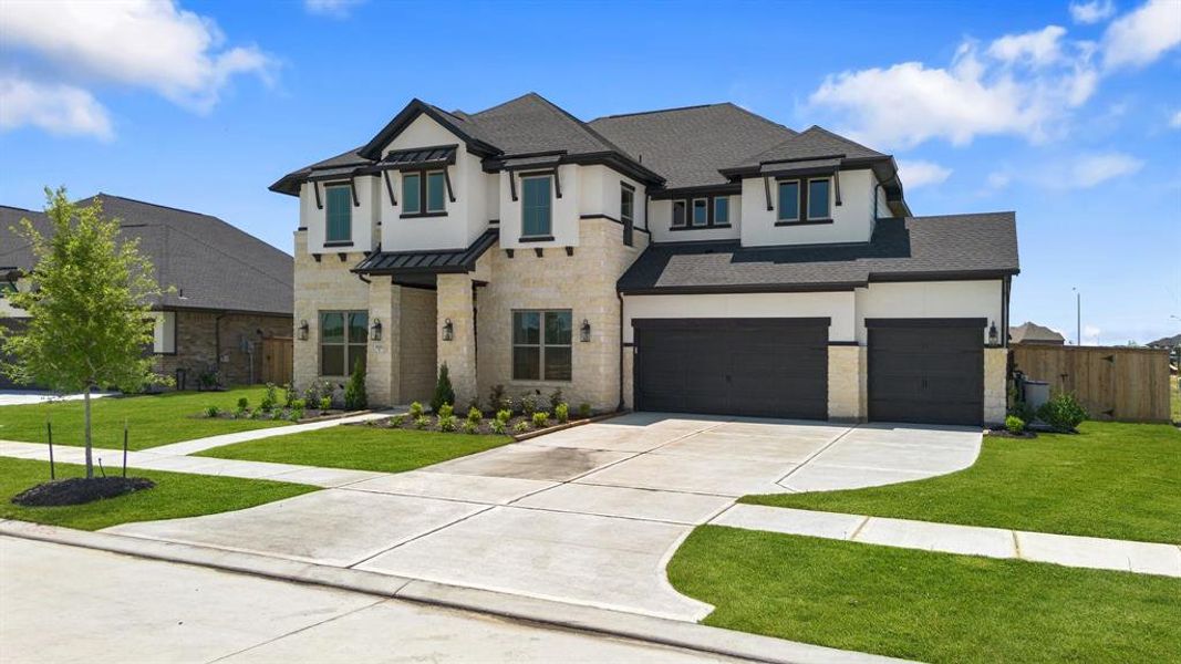 Front exterior of a new home in Valencia 60', Manvel, TX, highlighting curb appeal (Image 2).