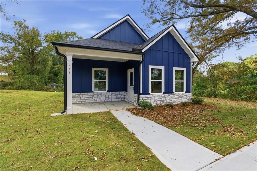 Front exterior of a new home in , Carrollton, GA, highlighting curb appeal (Image 19).