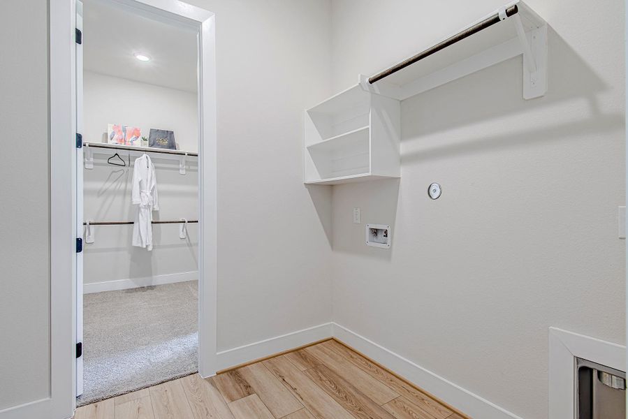 A unique layout connects the primary closet directly to the laundry room, adding ease to everyday living.