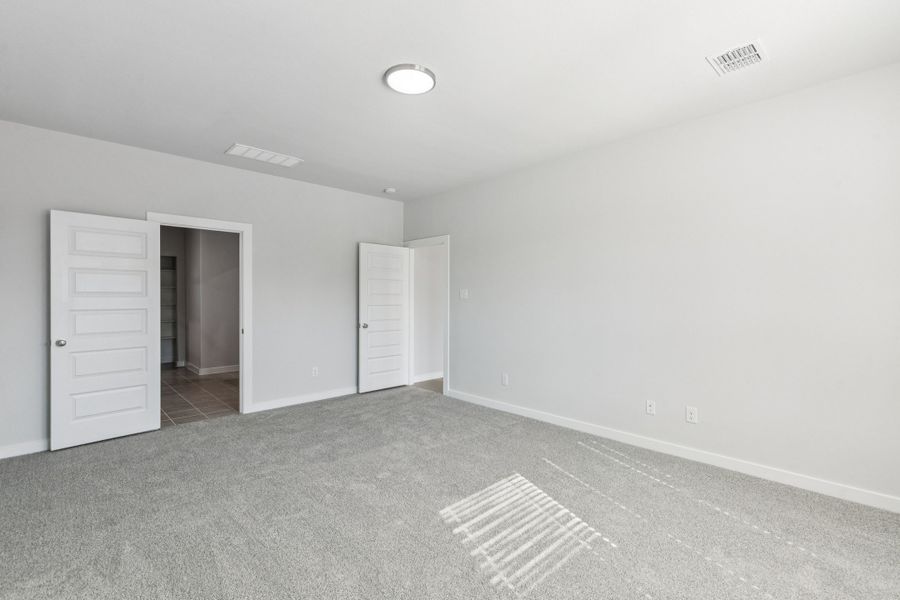 Primary Suite in the Winters home plan by Trophy Signature Homes – REPRESENTATIVE PHOTO