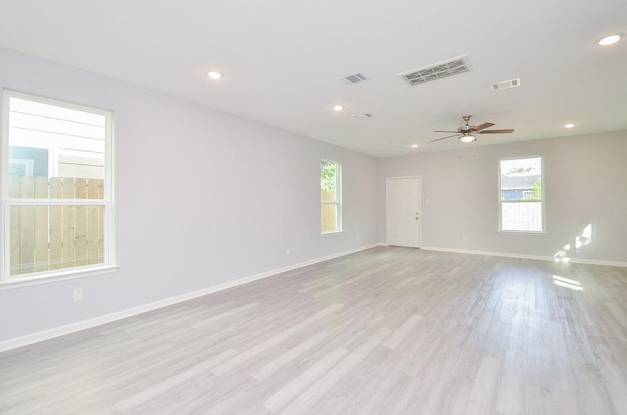 Open living room with generous seating space—ideal for movie nights and gatherings.