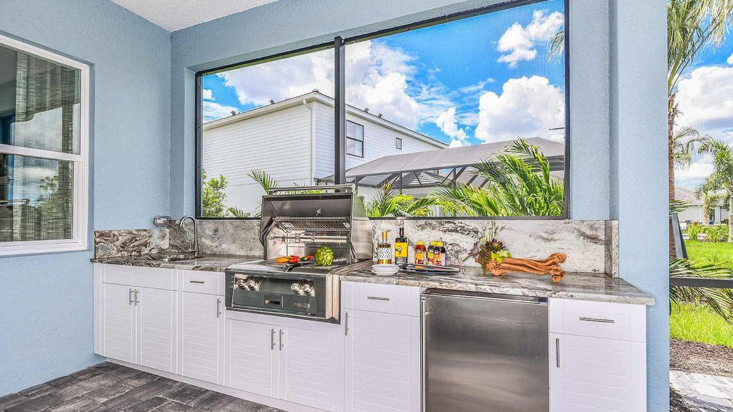 Exterior details and patio area of a home in SkySail Real Estate and Homes for Sale in Naples, FL - Neal Communities, Naples (Image 3).
