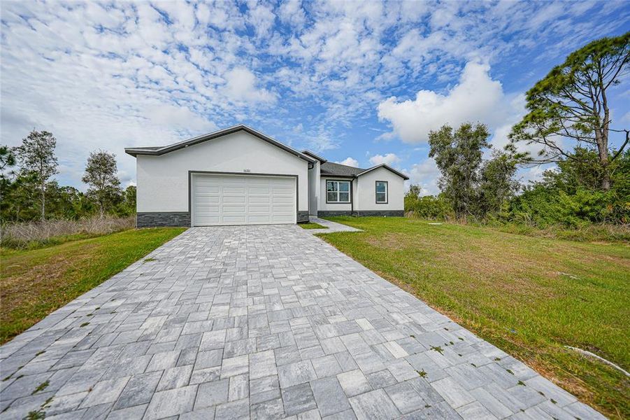 Front exterior of a new home in , Port Charlotte, FL, highlighting curb appeal (Image 22).