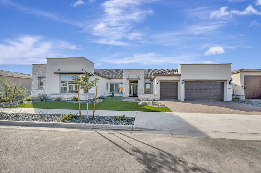 Front exterior of a new home in Tierra at Legado West, Queen Creek, AZ, highlighting curb appeal (Image 1). Front exterior of a new home in Tierra at Legado West, Queen Creek, AZ, highlighting curb appeal (Image 1).