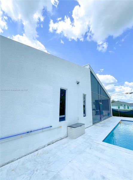 Front exterior of a new home in , Lehigh Acres, FL, highlighting curb appeal (Image 33). Front exterior of a new home in , Lehigh Acres, FL, highlighting curb appeal (Image 33).