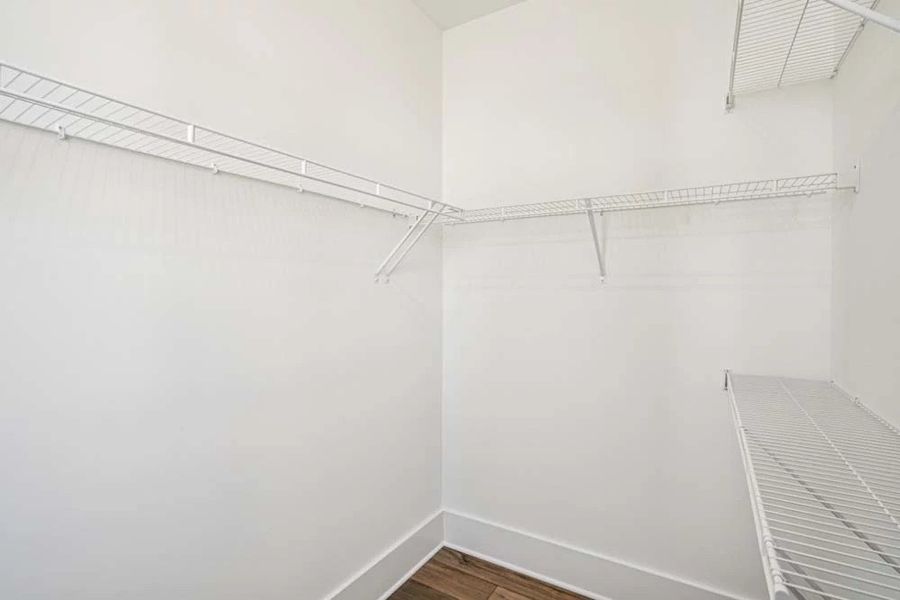 Primary Bedroom Walk-In Closet Primary Bedroom Walk-In Closet