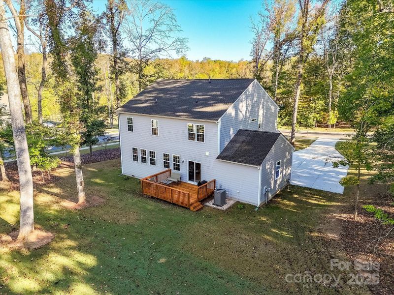 Mature Trees Surround this home, plus Common are across the street as well as, across the street on the right
