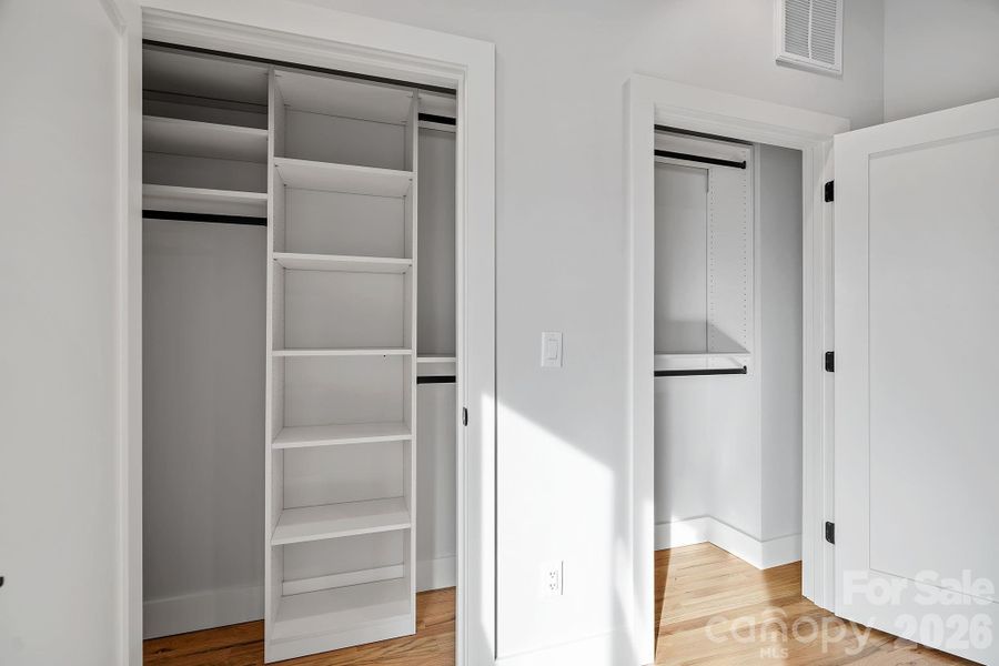 Professional Custom Closet in the Primary Suite Professional Custom Closet in the Primary Suite