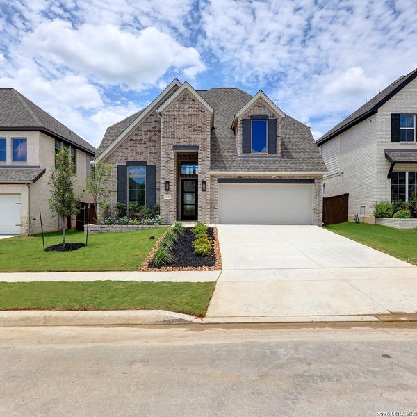 Front exterior of a new home in Corley Farms, Boerne, TX, highlighting curb appeal (Image 2).