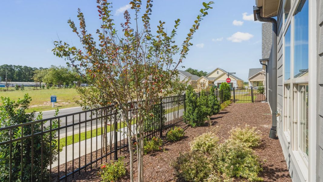 Exterior details and patio area of a home in Courtyards by Carrell, Ocean Isle Beach (Image 24). Exterior details and patio area of a home in Courtyards by Carrell, Ocean Isle Beach (Image 24).