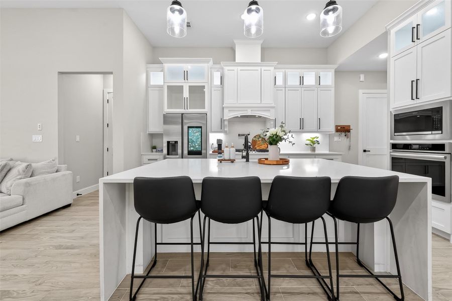 Gourmet kitchen with oversized island and seating area. Gourmet kitchen with oversized island and seating area.