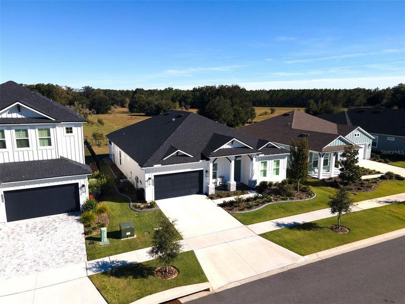 Front exterior of a new home in Oakmont, Gainesville, FL, highlighting curb appeal (Image 25).