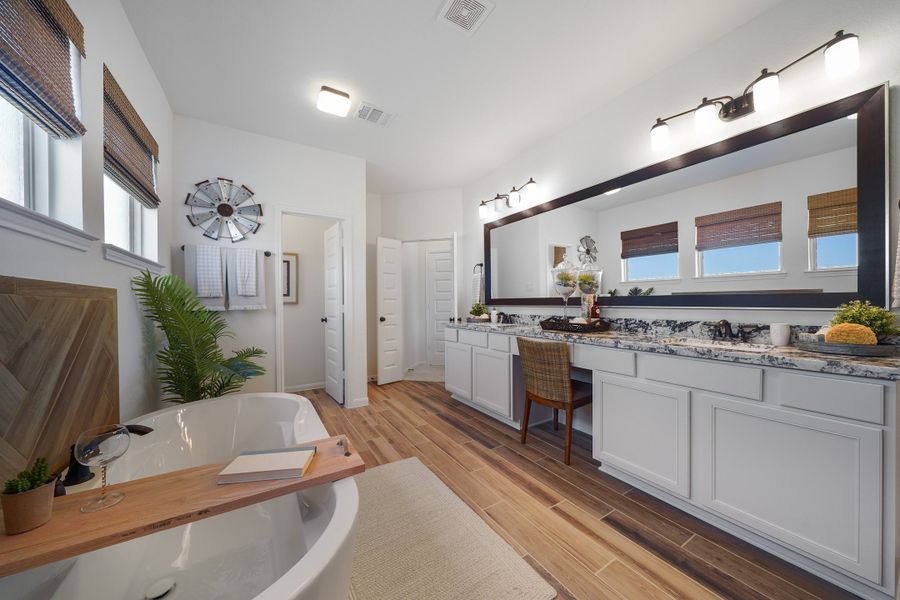 Owner's luxury bath with freestanding tub