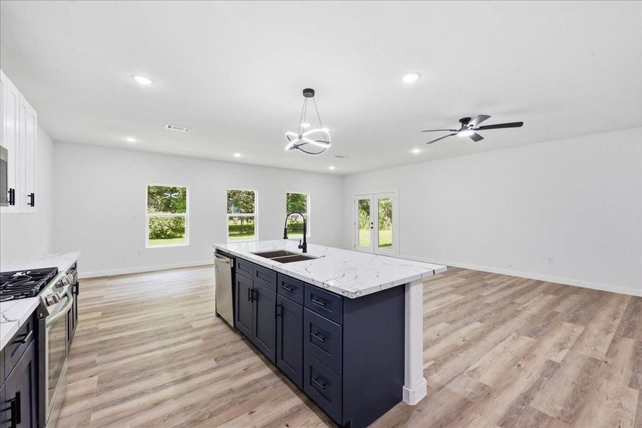 The massive kitchen island serves as the central hub of the home, perfect for entertaining. The massive kitchen island serves as the central hub of the home, perfect for entertaining.