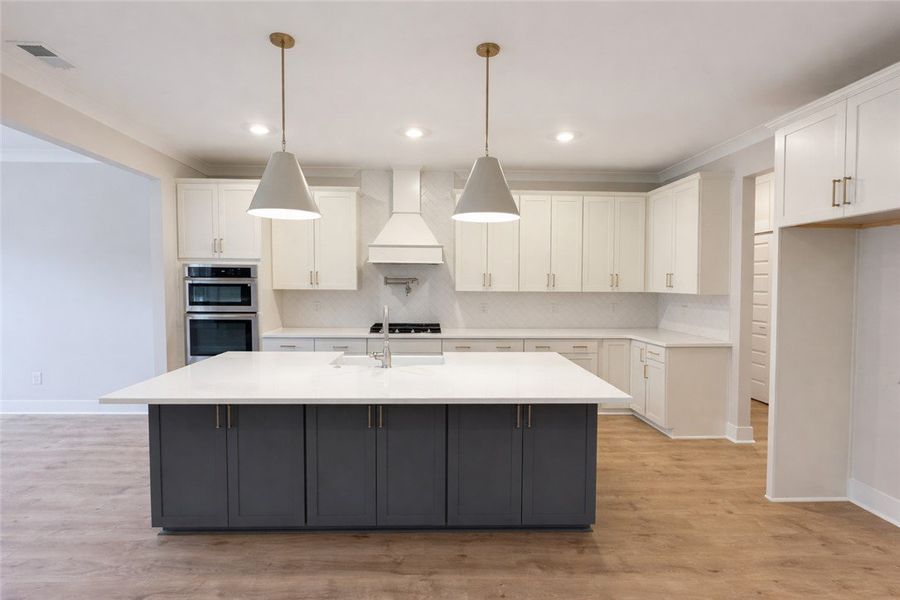 This modern kitchen features a spacious island and