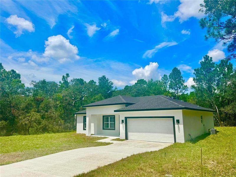 Front exterior of a new home in , Citrus Springs, FL, highlighting curb appeal (Image 17).