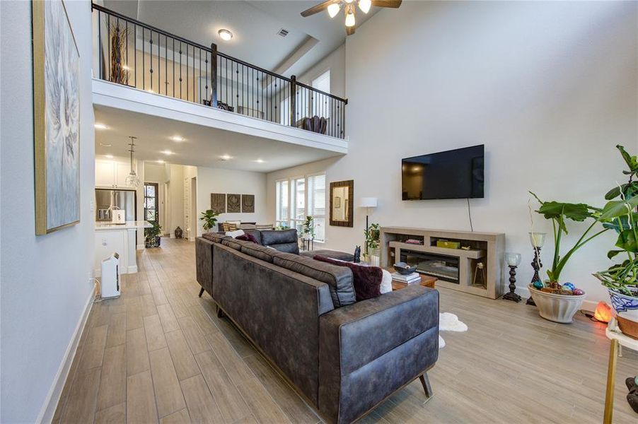 Open-concept living re-imagined: stunning two-story ceiling highlights the family area.