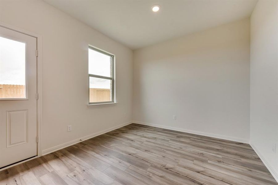 Empty room featuring light hardwood / wood-style flooring