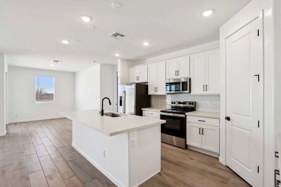 Kitchen featuring the Harmony Collection. Not actual home, finishes may vary by community. Kitchen featuring the Harmony Collection. Not actual home, finishes may vary by community.