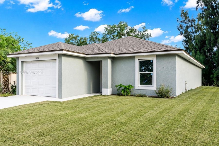 Front exterior of a new home in , Fort Myers, FL, highlighting curb appeal (Image 22). Front exterior of a new home in , Fort Myers, FL, highlighting curb appeal (Image 22).