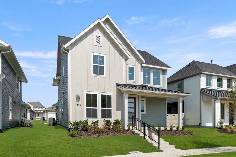 Front exterior of a new home in Carriage Collection at Painted Tree, McKinney, TX, highlighting curb appeal (Image 2). Front exterior of a new home in Carriage Collection at Painted Tree, McKinney, TX, highlighting curb appeal (Image 2).