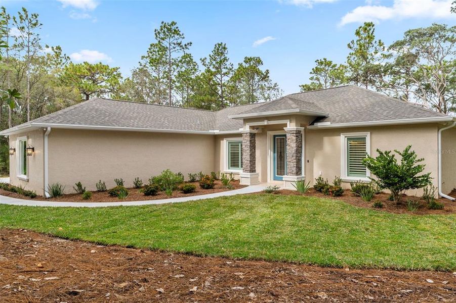 Front exterior of a new home in , Beverly Hills, FL, highlighting curb appeal (Image 2).