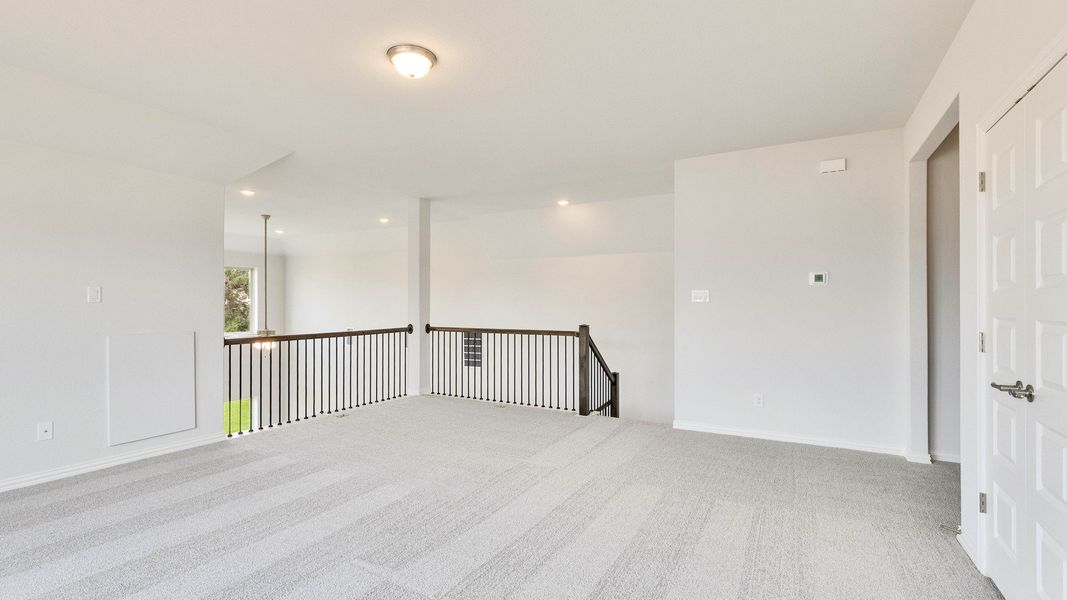 Furnished interior view inside a new home in Oaks at San Gabriel, Georgetown (Image 16).