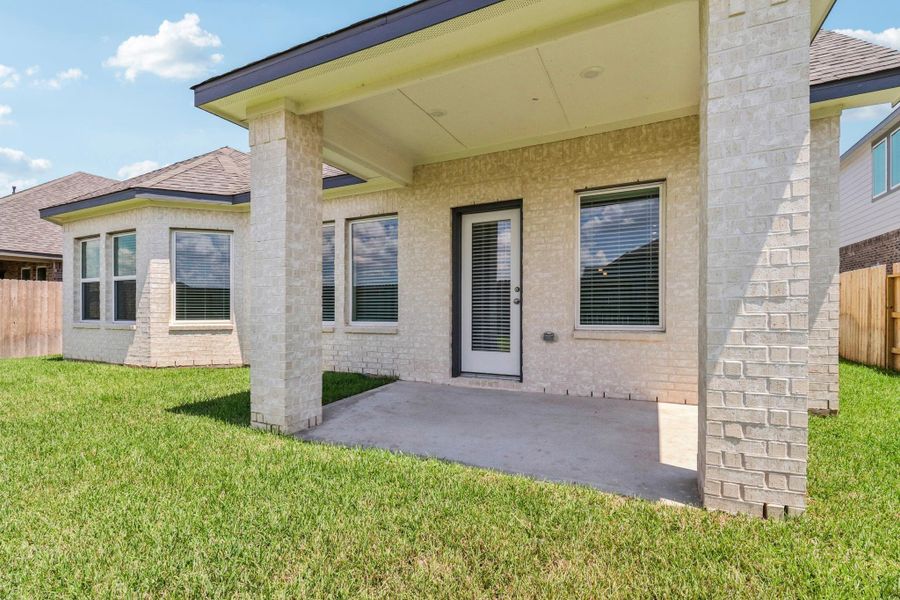 Front exterior of a new home in Kingdom Heights, Rosenberg, TX, highlighting curb appeal (Image 24). Front exterior of a new home in Kingdom Heights, Rosenberg, TX, highlighting curb appeal (Image 24).