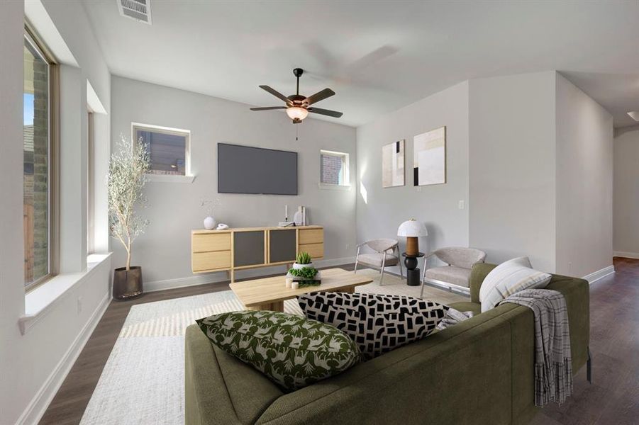 Living area featuring dark wood-style flooring and ceiling fan