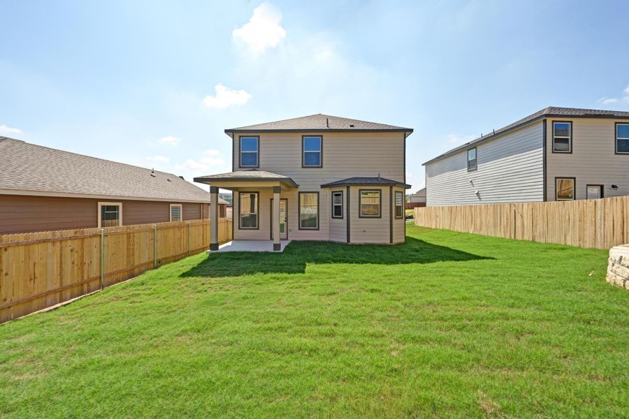 Front exterior of a new home in Creekside at Estancia, Austin, TX, highlighting curb appeal (Image 1). Front exterior of a new home in Creekside at Estancia, Austin, TX, highlighting curb appeal (Image 1).