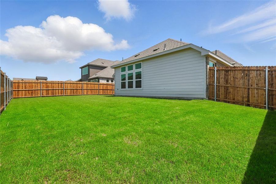 Rear view of house featuring roof with shingles Rear view of house featuring roof with shingles